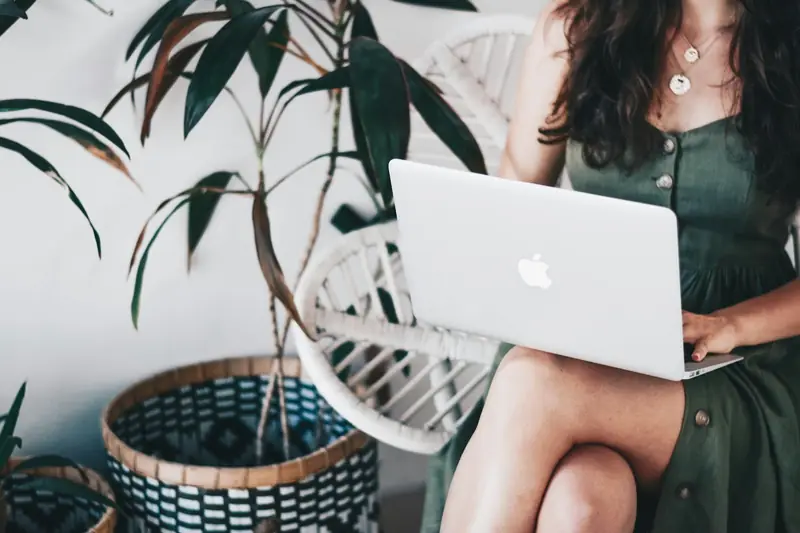 A blogger working on a laptop at home