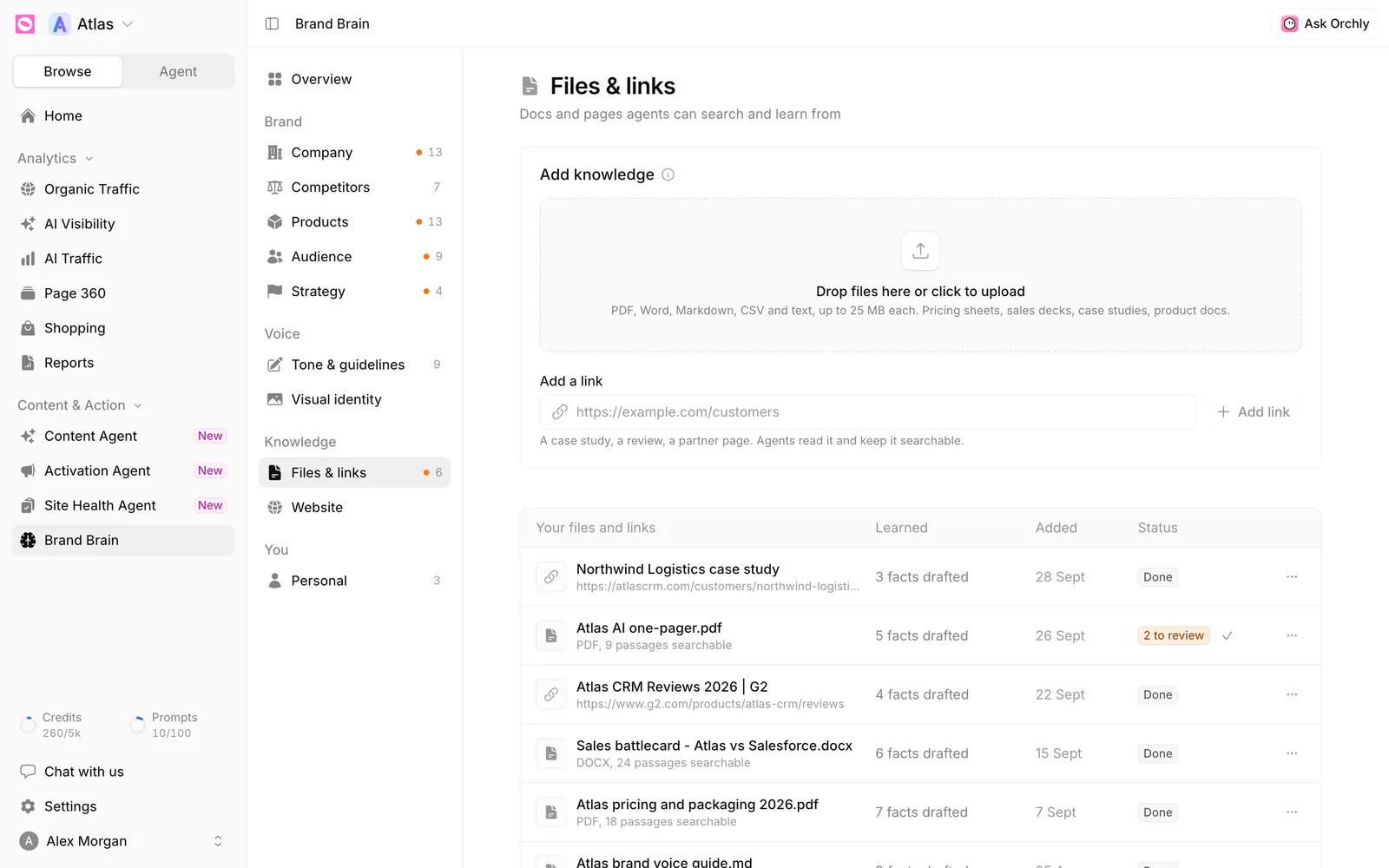 Brand Brain Files and links section with an upload drop zone, an Add a link field, and a table of files and links showing facts drafted, date added and status